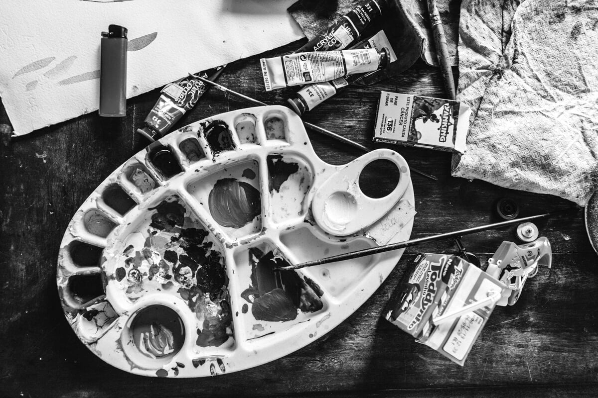 Art tools placed on wooden table